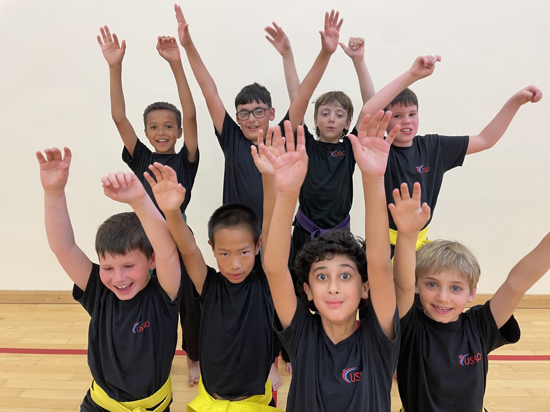 Children celebrating with their arms raised